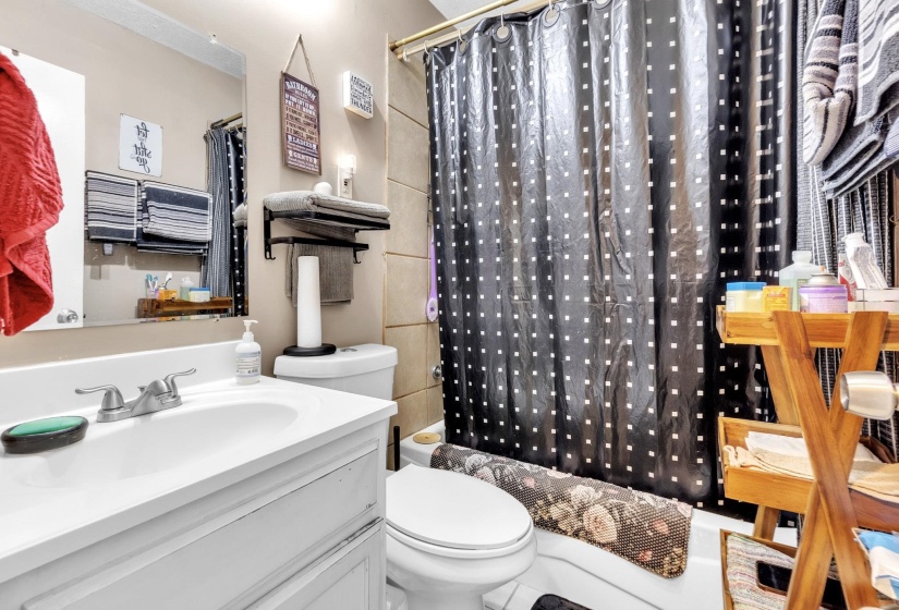 Bathroom featuring vanity and toilet
