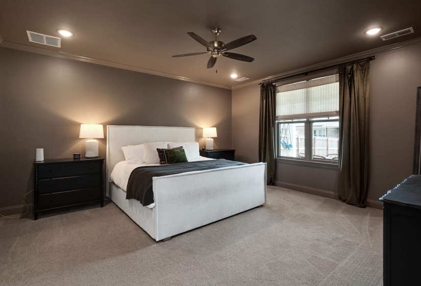 Bedroom featuring crown molding, light colored carpet, ceiling fan, and recessed lighting