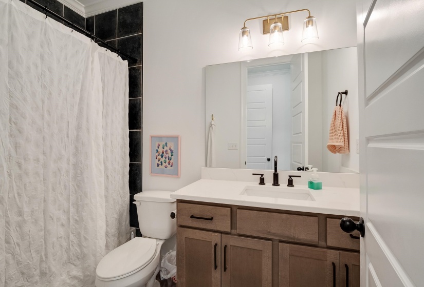 Bathroom with vanity and a shower with curtain