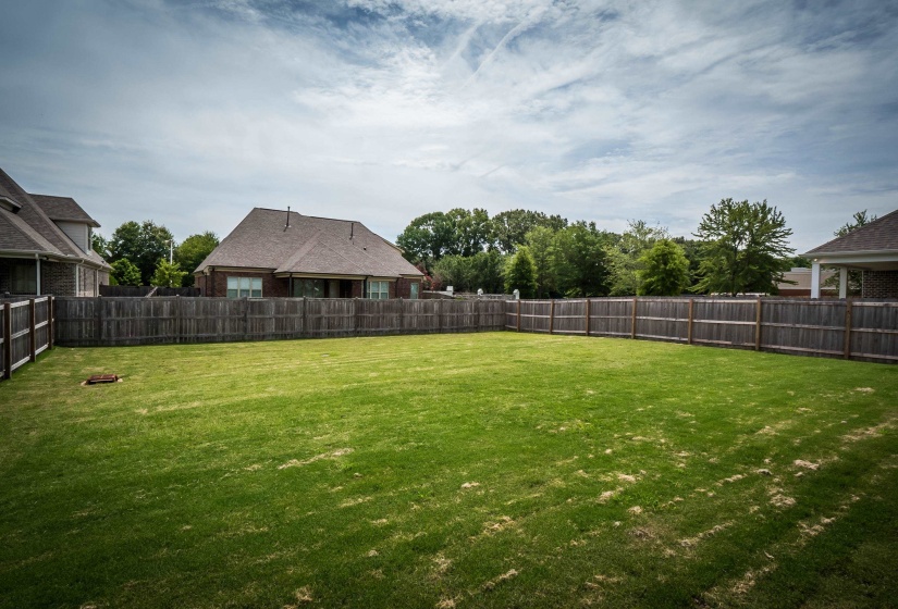 View of fenced backyard