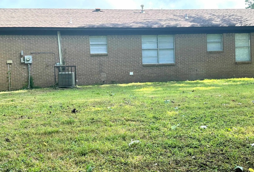View of back of home and yard
