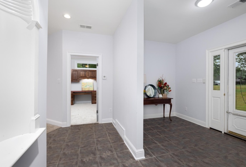 Foyer with baseboards and recessed lighting