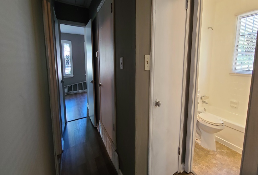 Hallway featuring wood-type flooring