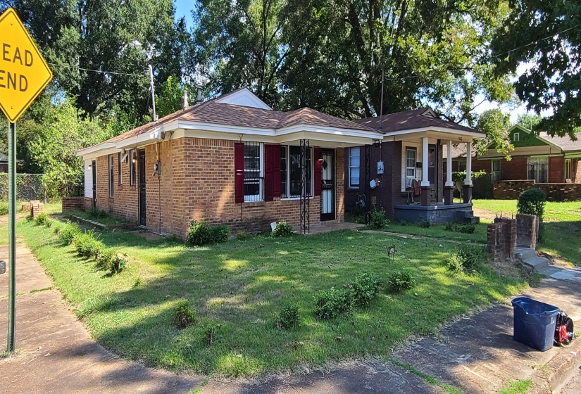 Single story home featuring a front yard and a porch