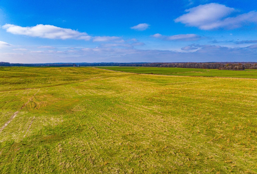 View of mountain backdrop with rural landscape