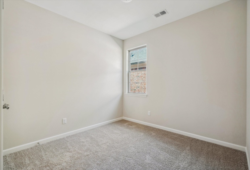 Empty room with baseboards and light carpet