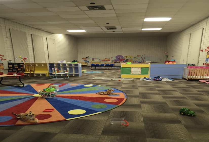 Rec room featuring visible vents, carpet, and a paneled ceiling