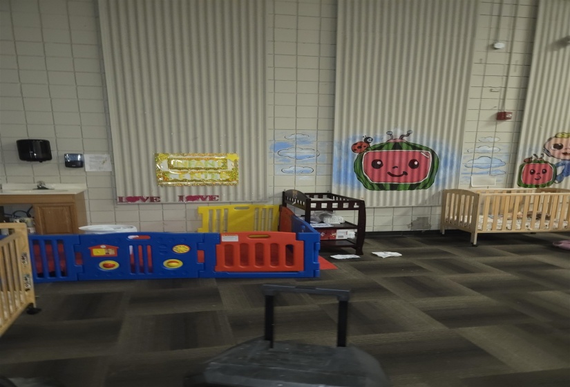 Interior space with carpet floors and tile walls