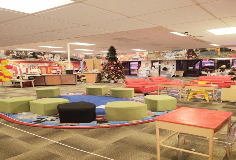 Interior space with carpet floors and a paneled ceiling