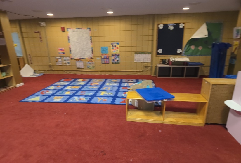 Recreation room featuring carpet flooring and recessed lighting