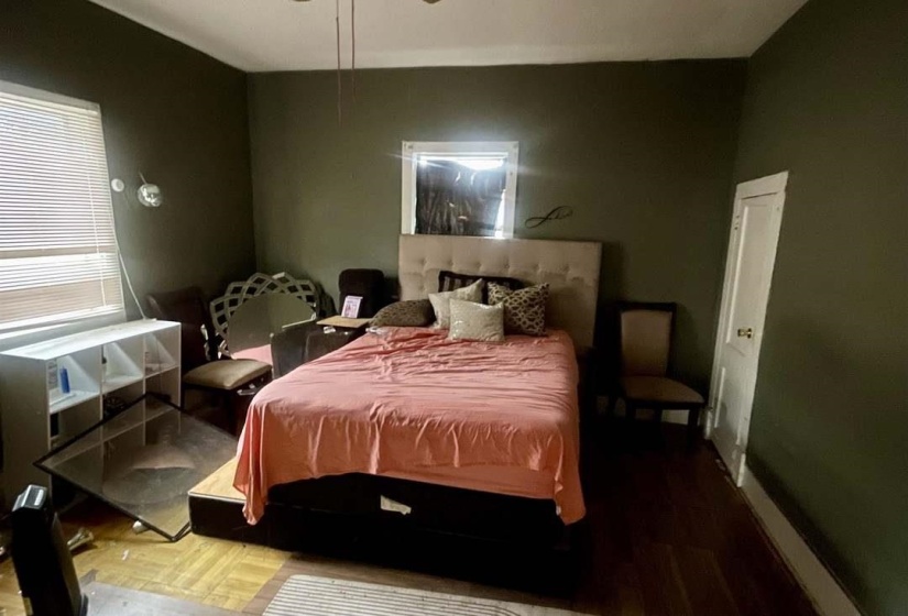Bedroom with wood finished floors