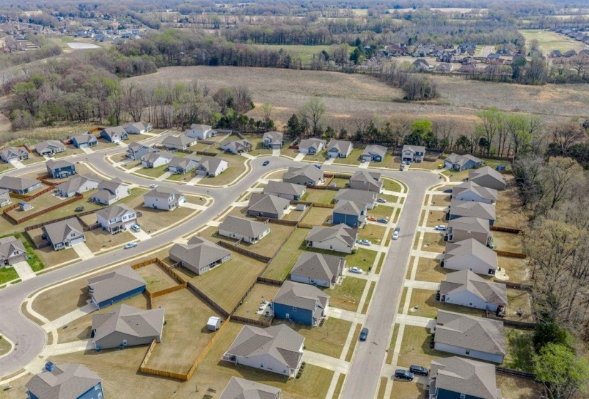 Aerial overview of property's location featuring nearby suburban area