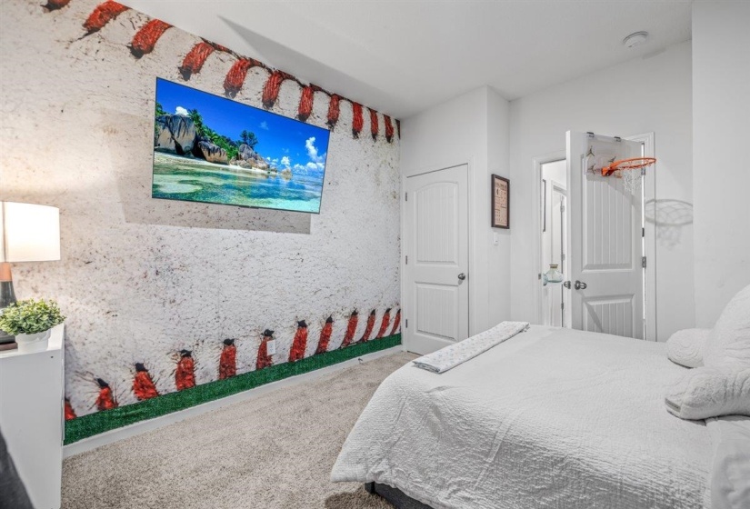 Bedroom with light colored carpet