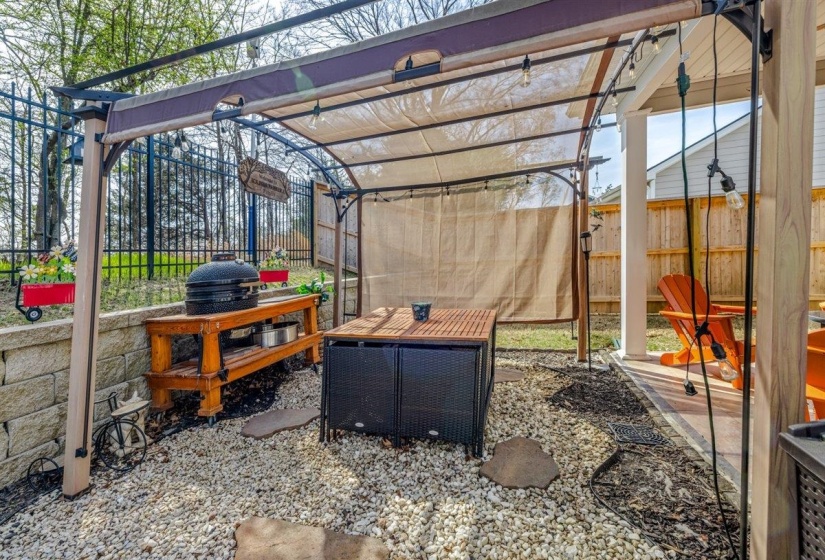 View of patio with a pergola and a grill