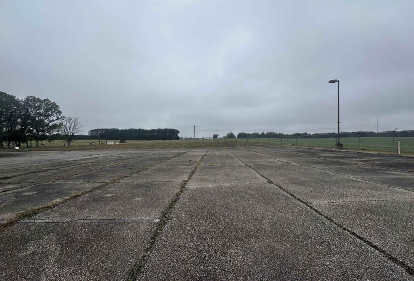 View of road with a rural view and street lights