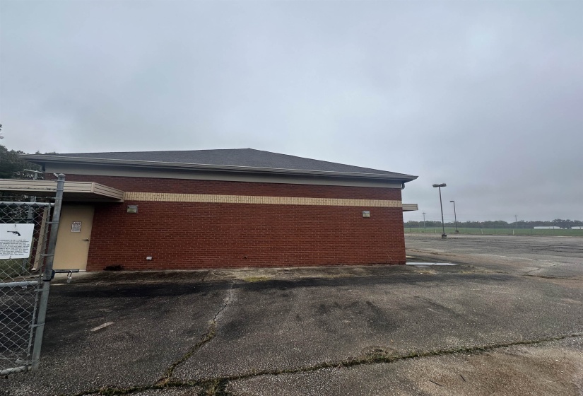 View of side of home with brick siding