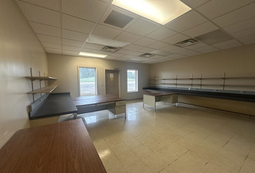Playroom featuring a paneled ceiling, visible vents, and light floors