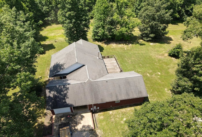 Overhead perspective showcasing a residential structure with a gray shingle roof