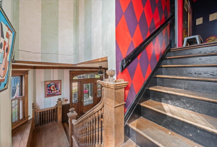 Stairway featuring hardwood / wood-style flooring