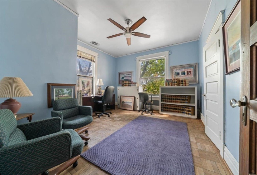 Office featuring ornamental molding, parquet flooring, and ceiling fan