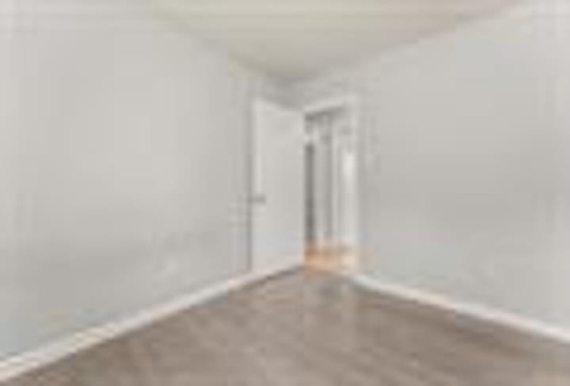 Unfurnished room featuring baseboards