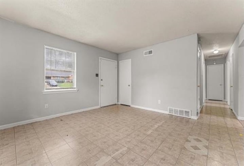 Unfurnished room featuring baseboards