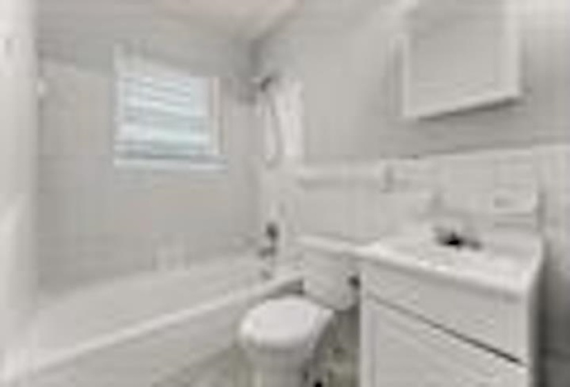Bathroom featuring vanity and shower / bath combination