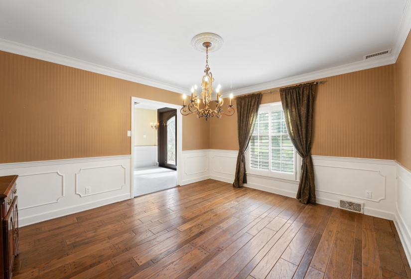 Pegged hardwood floors and modern chandelier