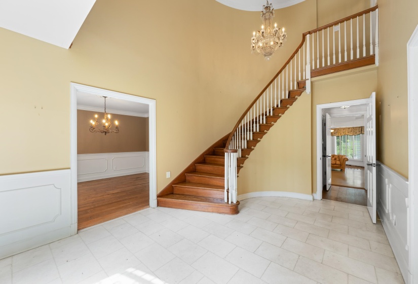 2-story entry, marble floors, winding stairway  ornamental molding and chandelier