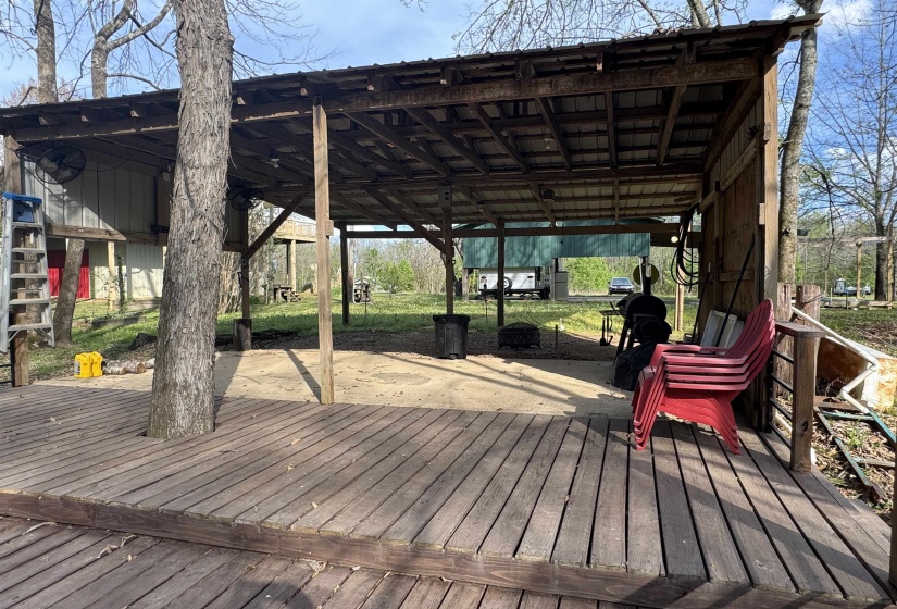 Outdoor Fans, TV Hookup and multiple outlets for all of your needs. Fish cleaning area to the side of this covered space.