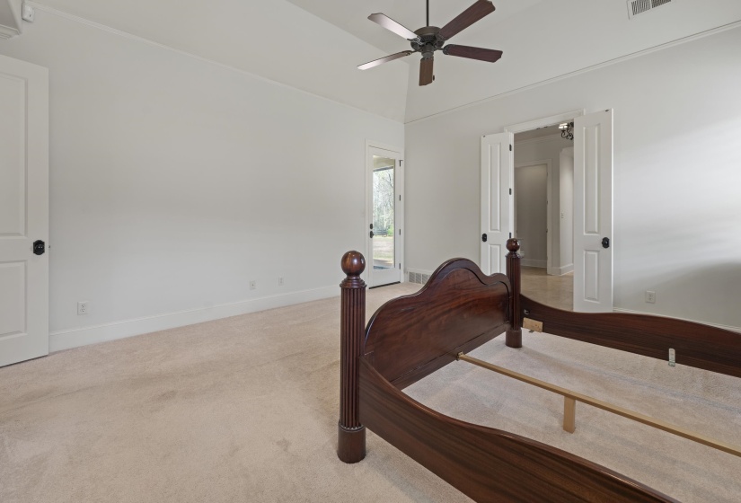 Bedroom featuring ceiling fan and vaulted ceiling