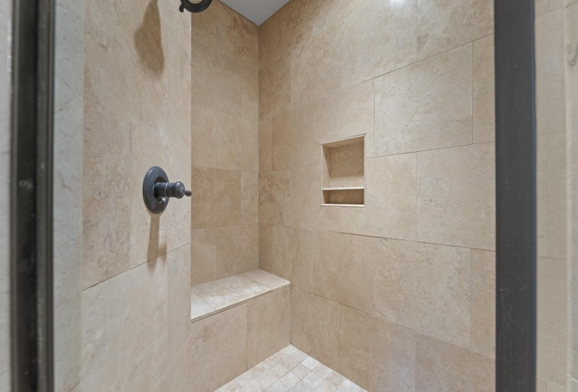 Full bathroom with tiled shower