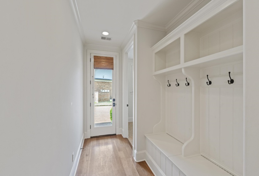 Mudroom featuring crown molding, light wood finished floors, and recessed lighting