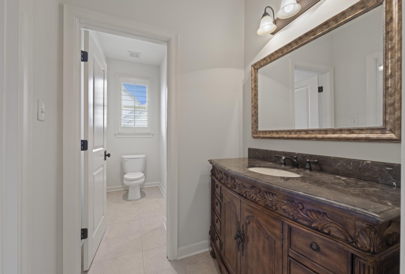 Bathroom with vanity and light tile patterned flooring