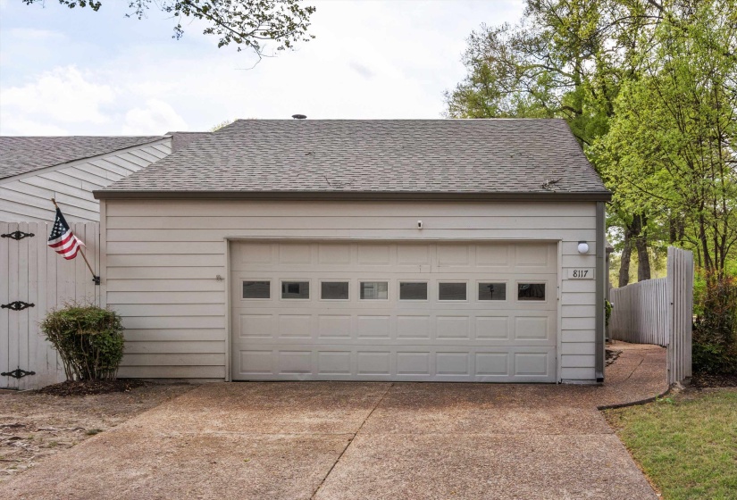 Garage with driveway and a gate