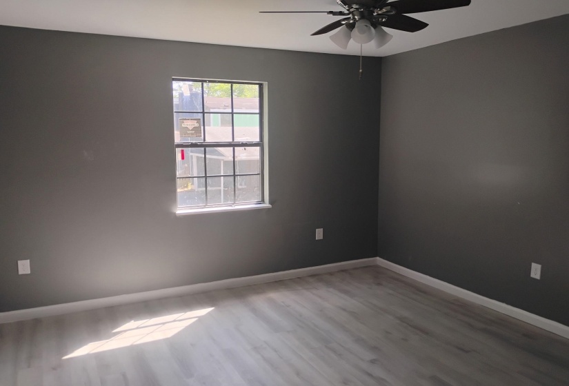 Spare room featuring light wood finished floors and a ceiling fan