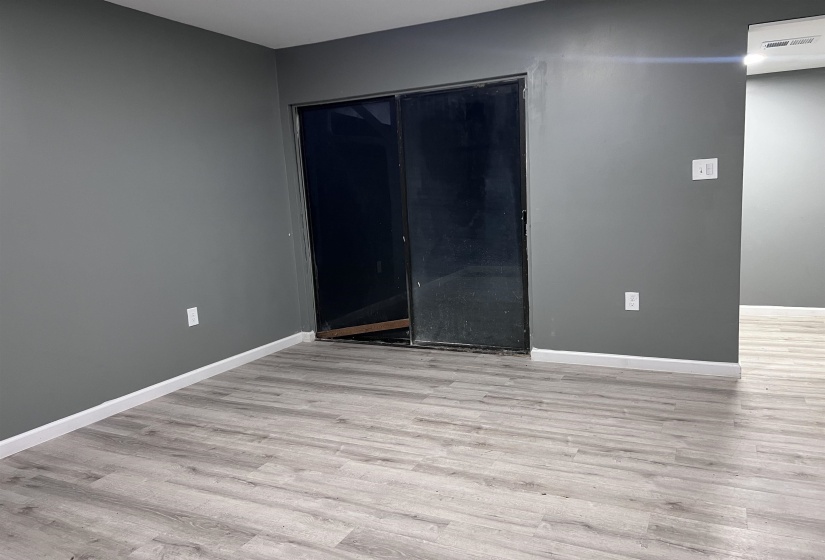 Empty room featuring light wood-style flooring and baseboards