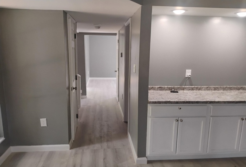 Hallway featuring baseboards and light wood-type flooring