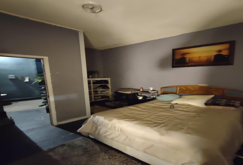 Bedroom featuring lofted ceiling