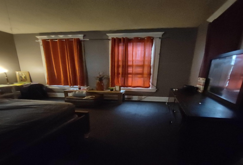 Bedroom featuring baseboards