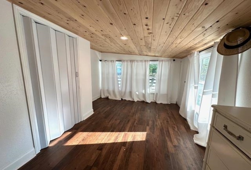 Interior space featuring wooden ceiling and wood-type flooring