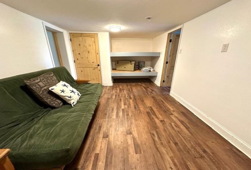 Bonus Room or bedroom featuring dark hardwood / wood-style flooring and built in bunk beds