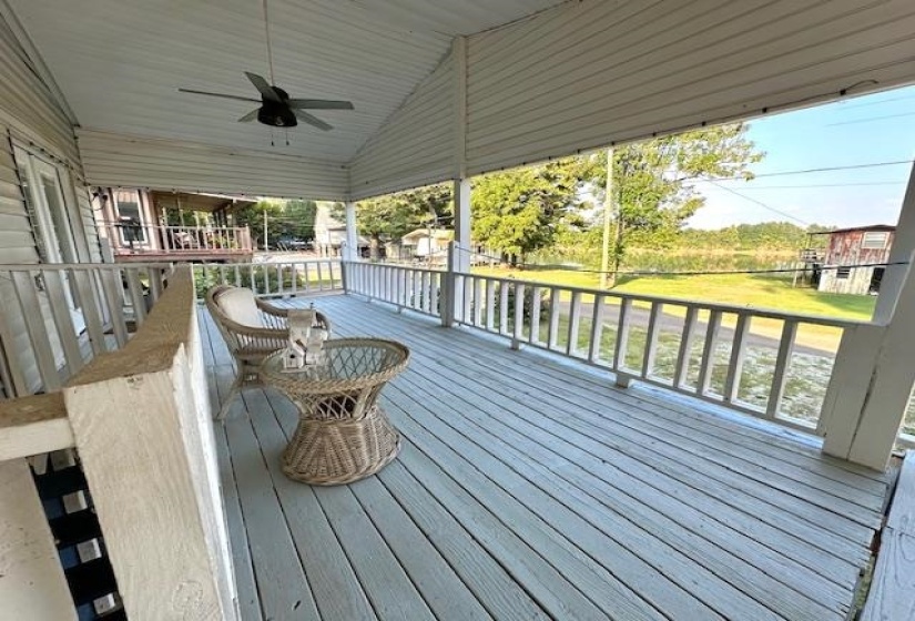 Wooden deck featuring ceiling fan