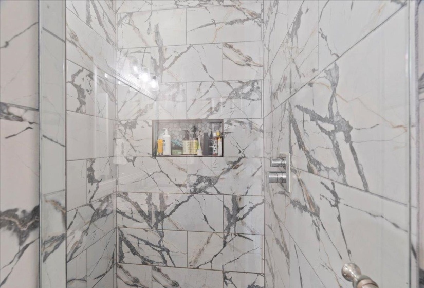 Bathroom with a tile shower