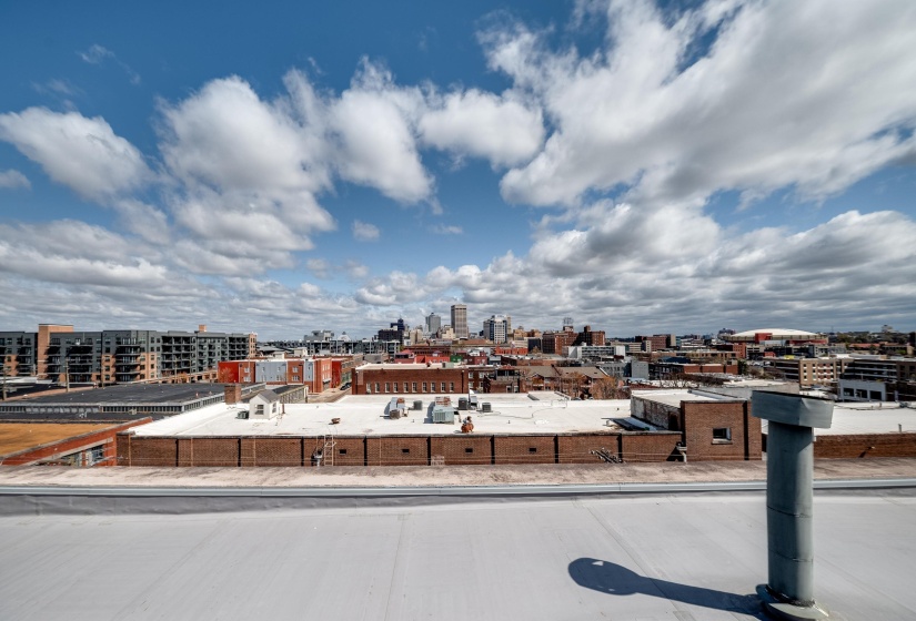 Exterior space featuring curbs, a view of city, and sidewalks