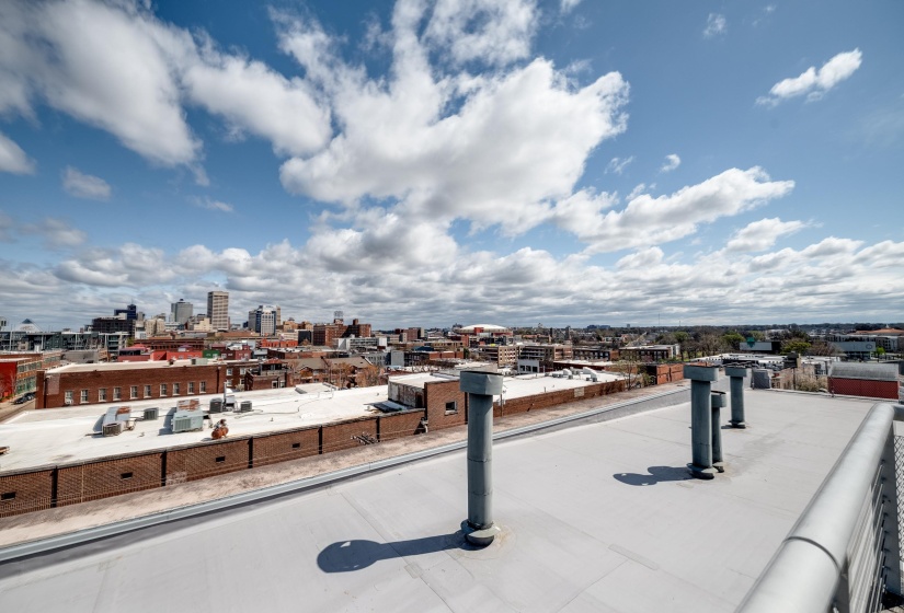 Exterior space with a balcony and a view of city