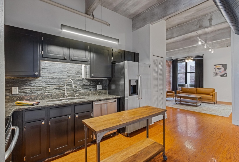 Stainless, granite,tile backsplash, great cabinets, pantry and laundry room
