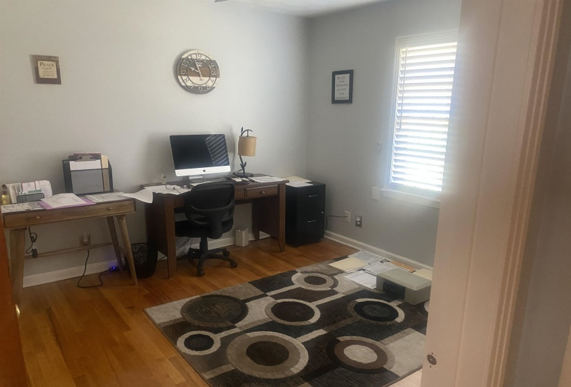 Office space featuring light wood-style flooring