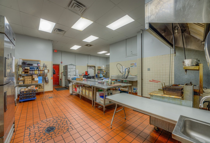 Miscellaneous room featuring a sink and a drop ceiling