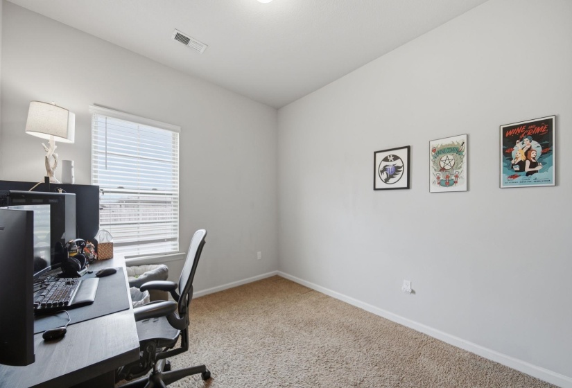 Office with light carpet and baseboards